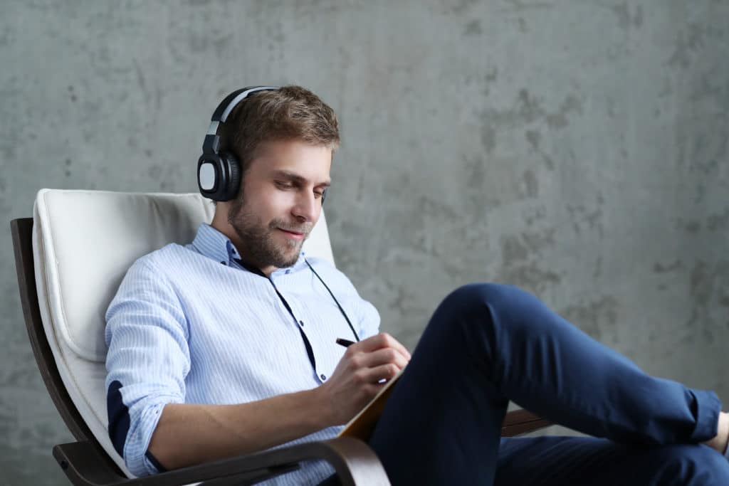 handsome man listening music headphones scaled