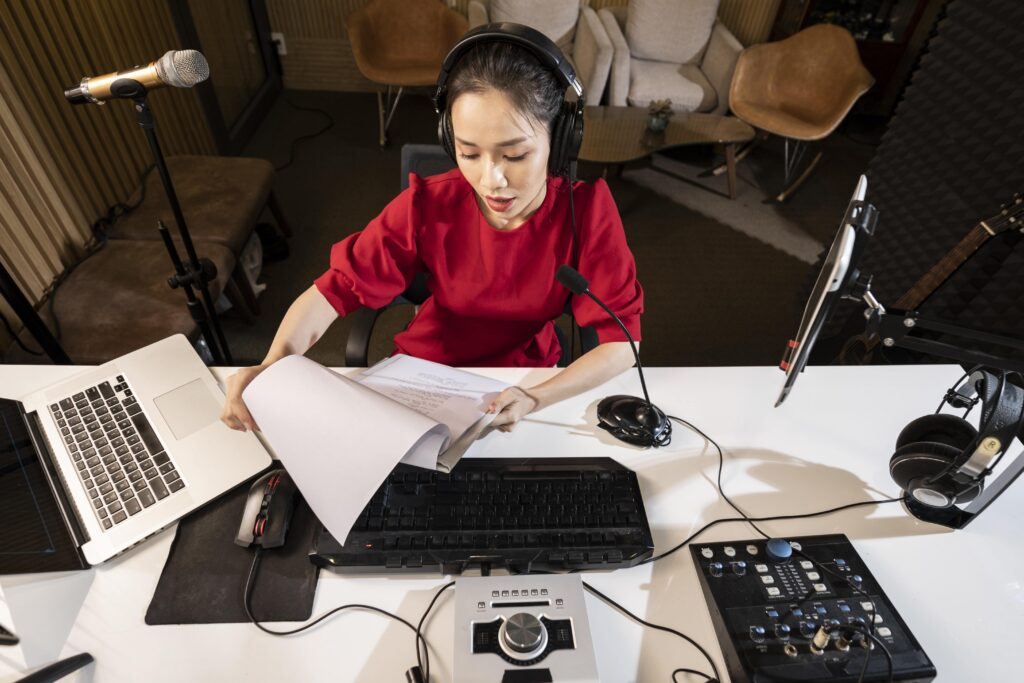 high angle woman working radio with professional equipment min - Prism.fm